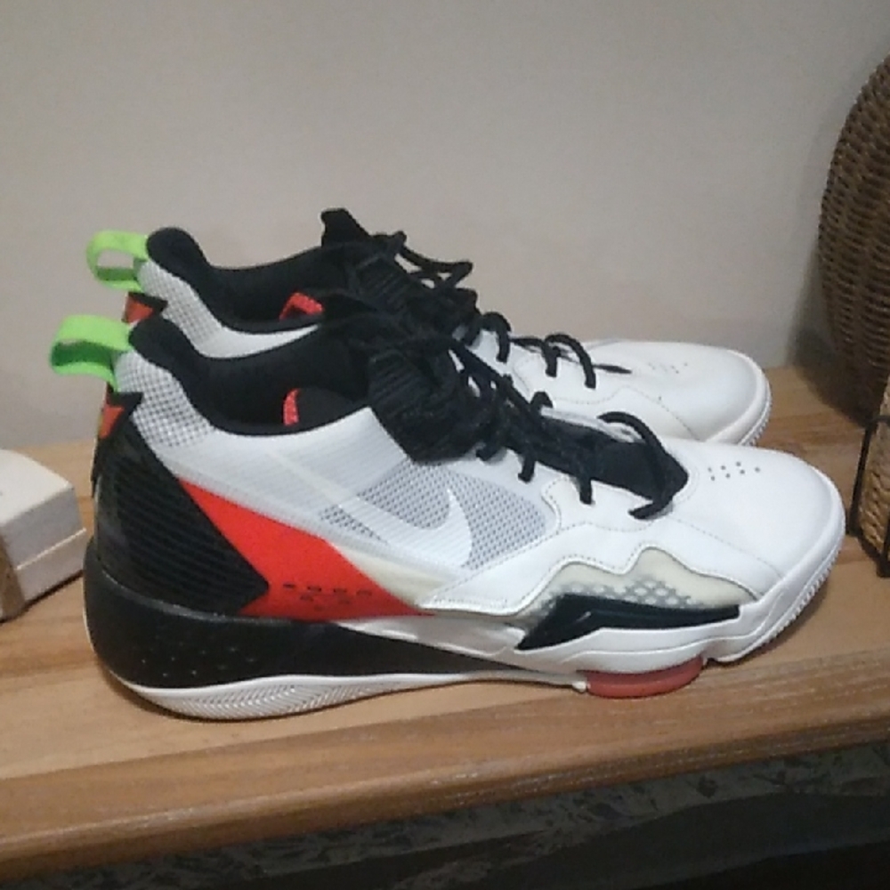 White and Black Athletic Sneakers with Red Accents
